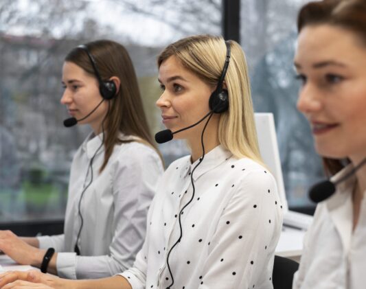 colleagues-working-together-call-center-with-headphones colleagues-working-together-call-center-with-headphones