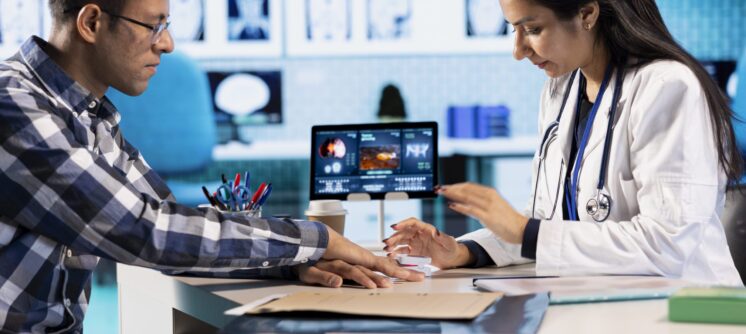 Healthcare professional uses an oximeter to measure the oxygen levels for a patient at check up, diagnostic tools for accurate medical advice. Monitoring pulse and saturation with indicator.
