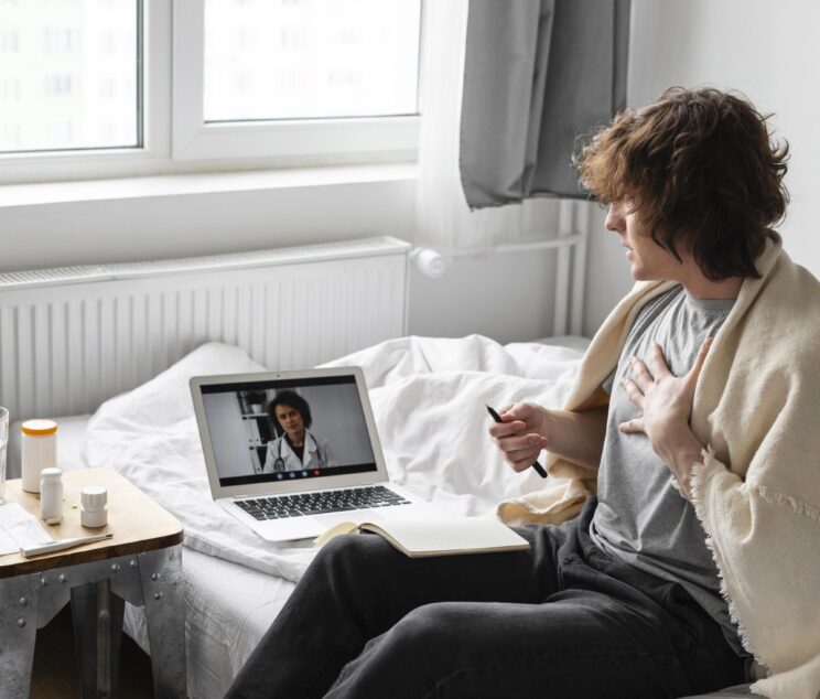 man-taking-notes-from-his-doctor