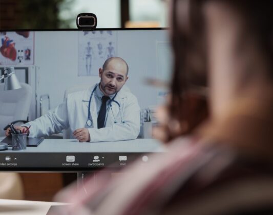 Patient talking with doctor on videocall, medical specialist consultation Patient talking with doctor on videocall, telemedicine, online checkup, medical specialist consultation. Woman chatting with therapist on internet, discussing health with general practiotioner