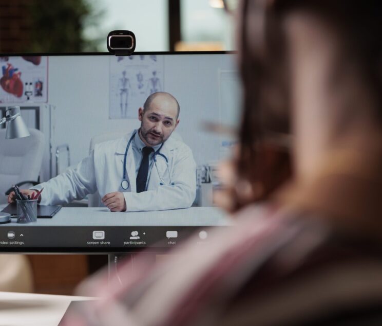 Patient talking with doctor on videocall, telemedicine, online checkup, medical specialist consultation. Woman chatting with therapist on internet, discussing health with general practiotioner